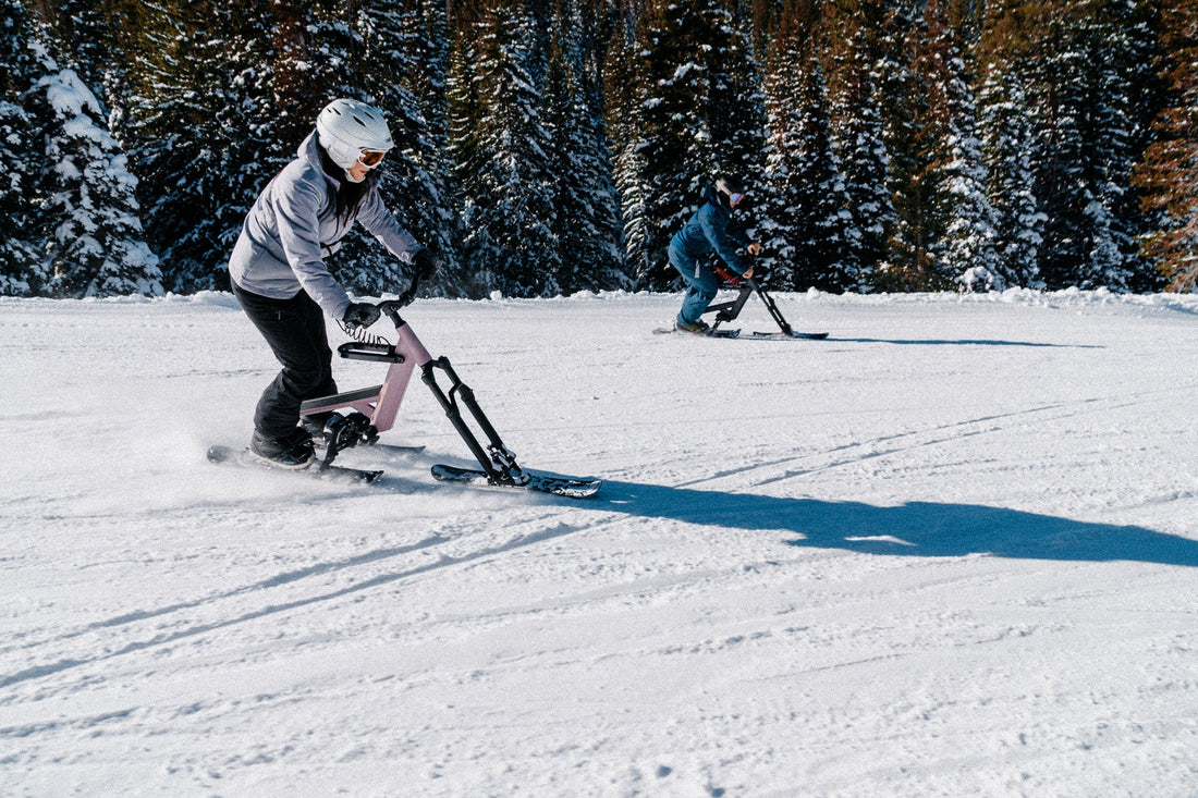 First-time ski bike rider grinning through a turn on a green run in Park City, Utah