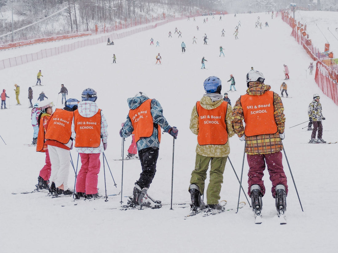 Ski instructor teaching a beginners on a green run in Park City, Utah